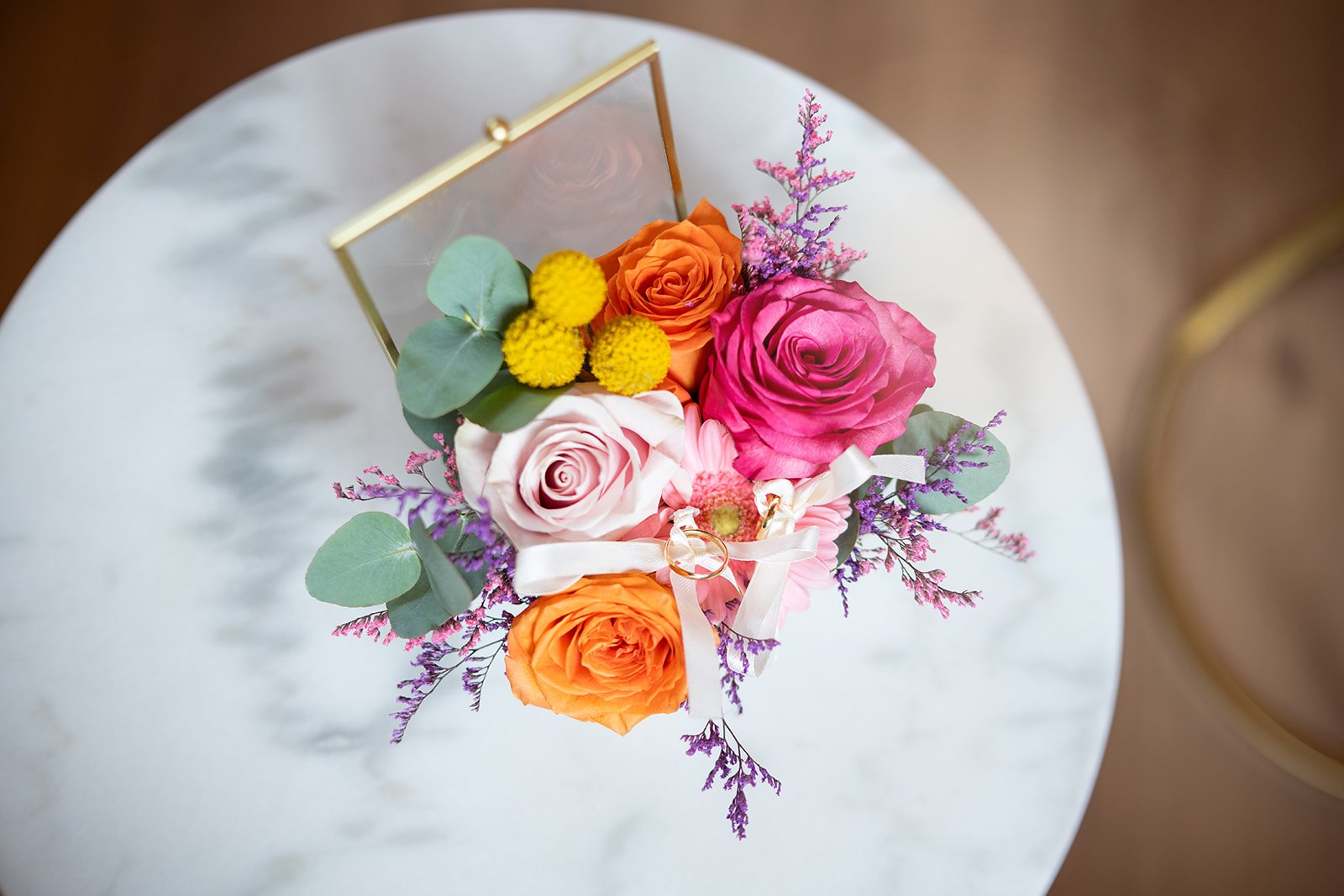 Ceremony under a floral arch at dusk in Tuscany