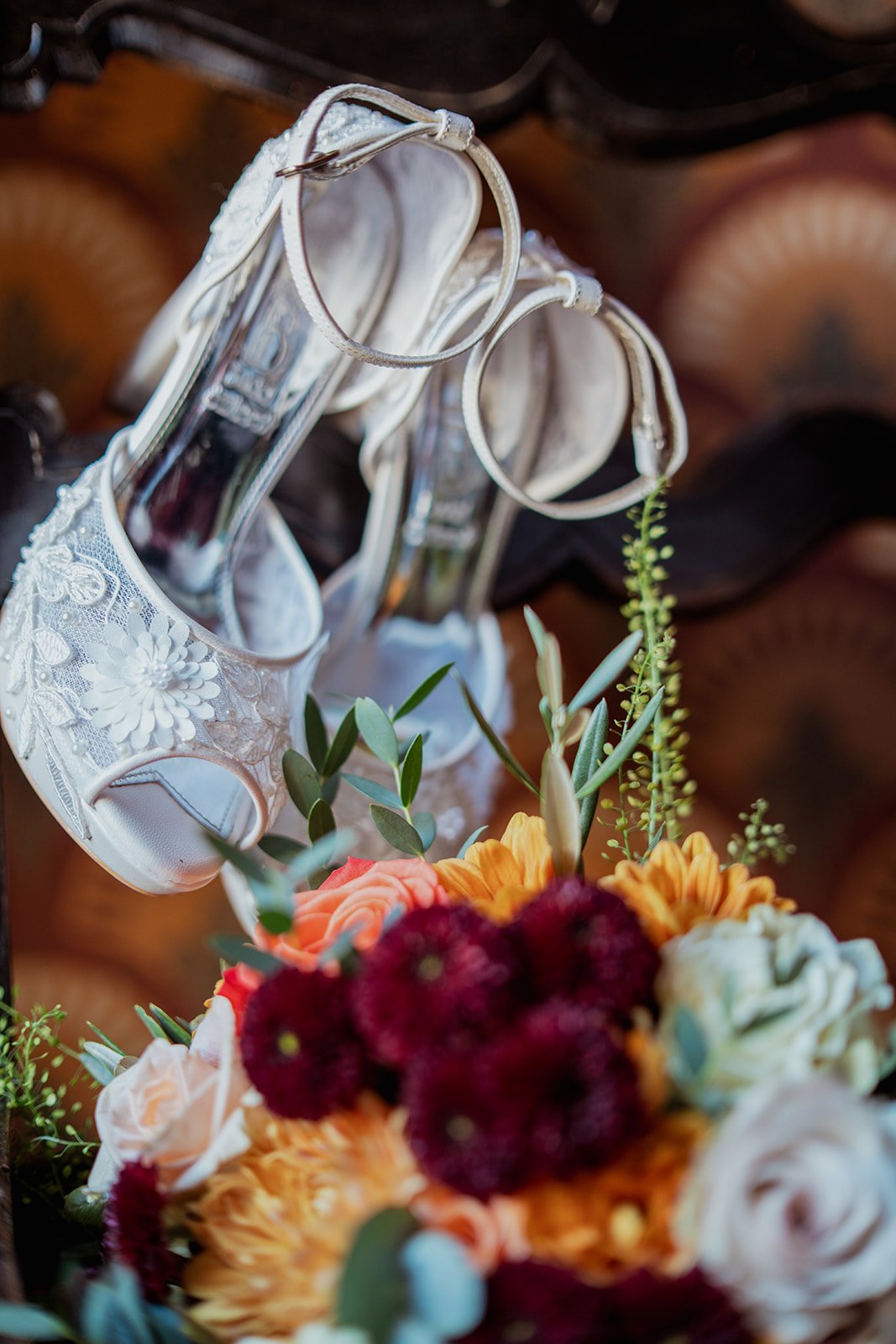 Bride by a sunlit villa window