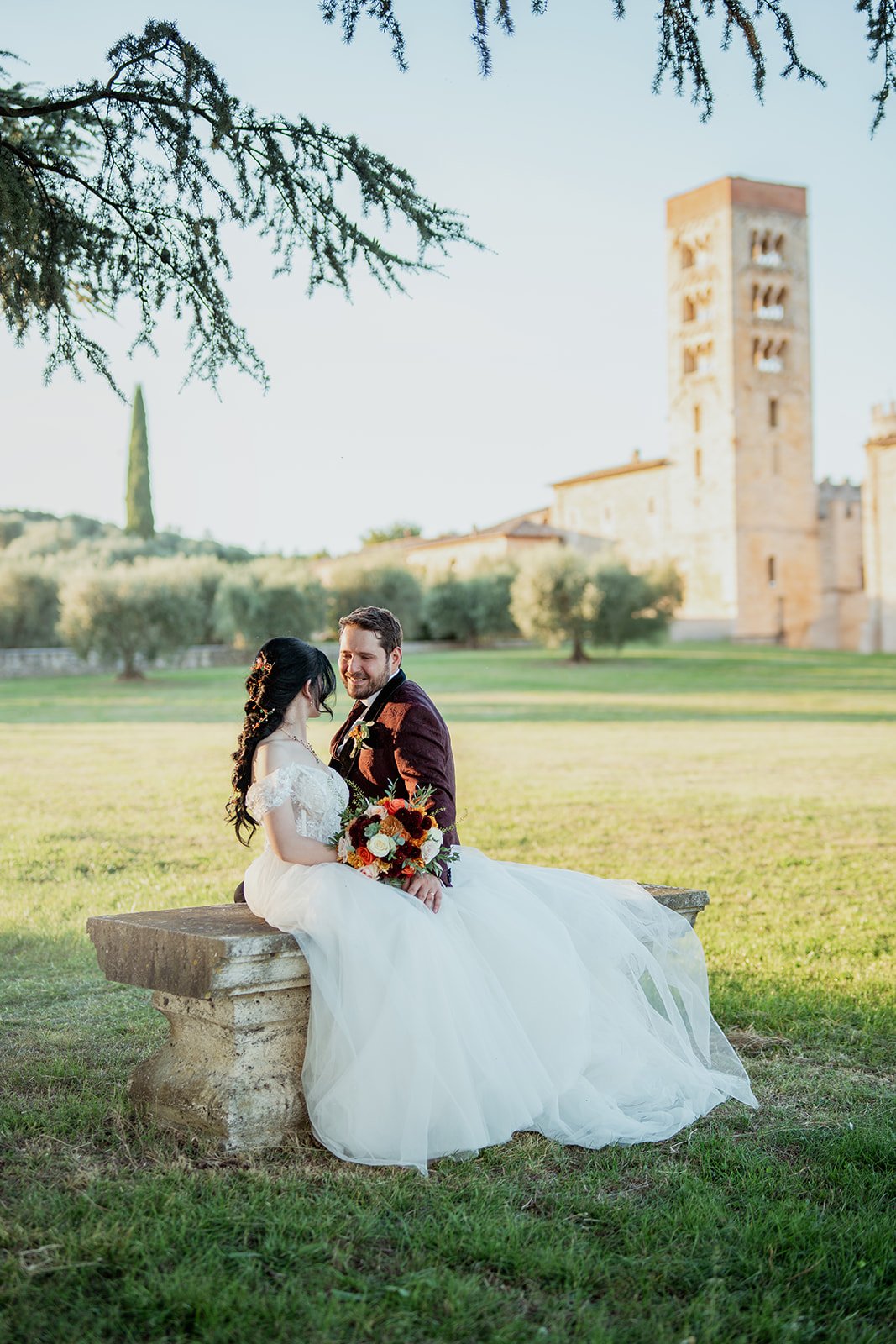 Dusk garden ceremony under floral arch
