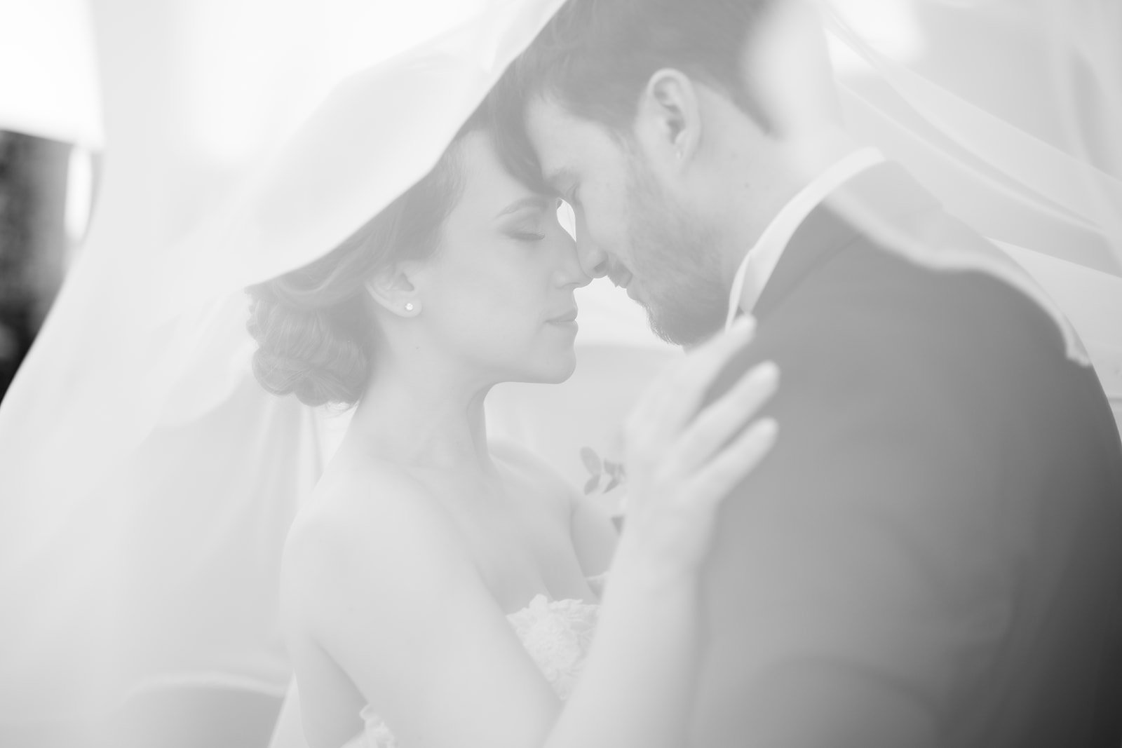 Bride walking through Tuscany arches
